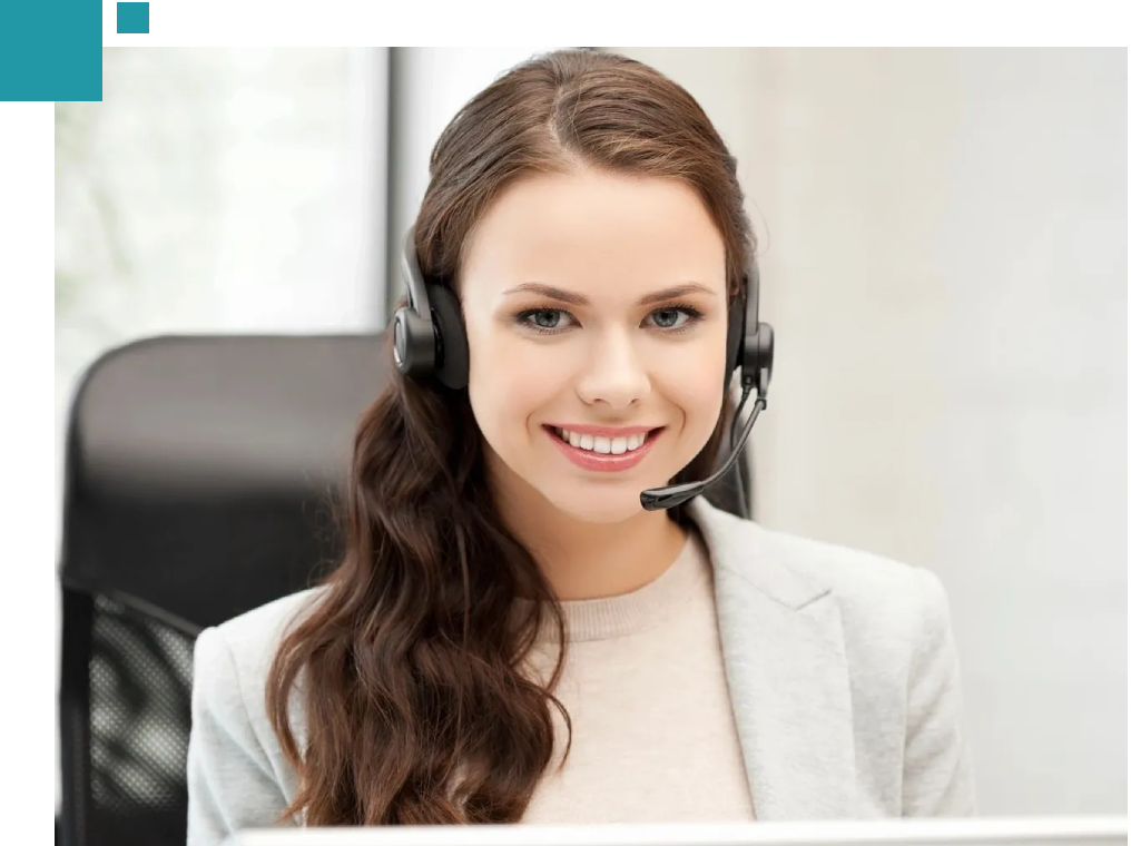 A woman wearing headphones and smiling for the camera.