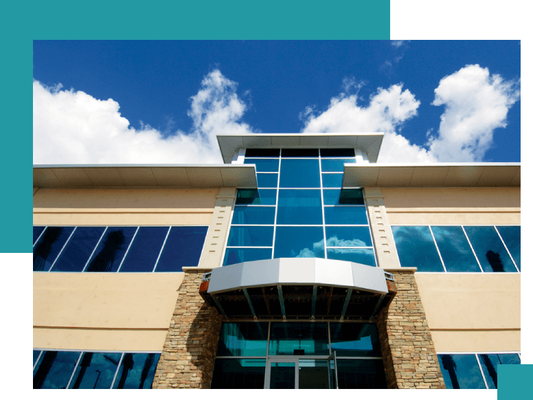 A building with a sky background and some clouds